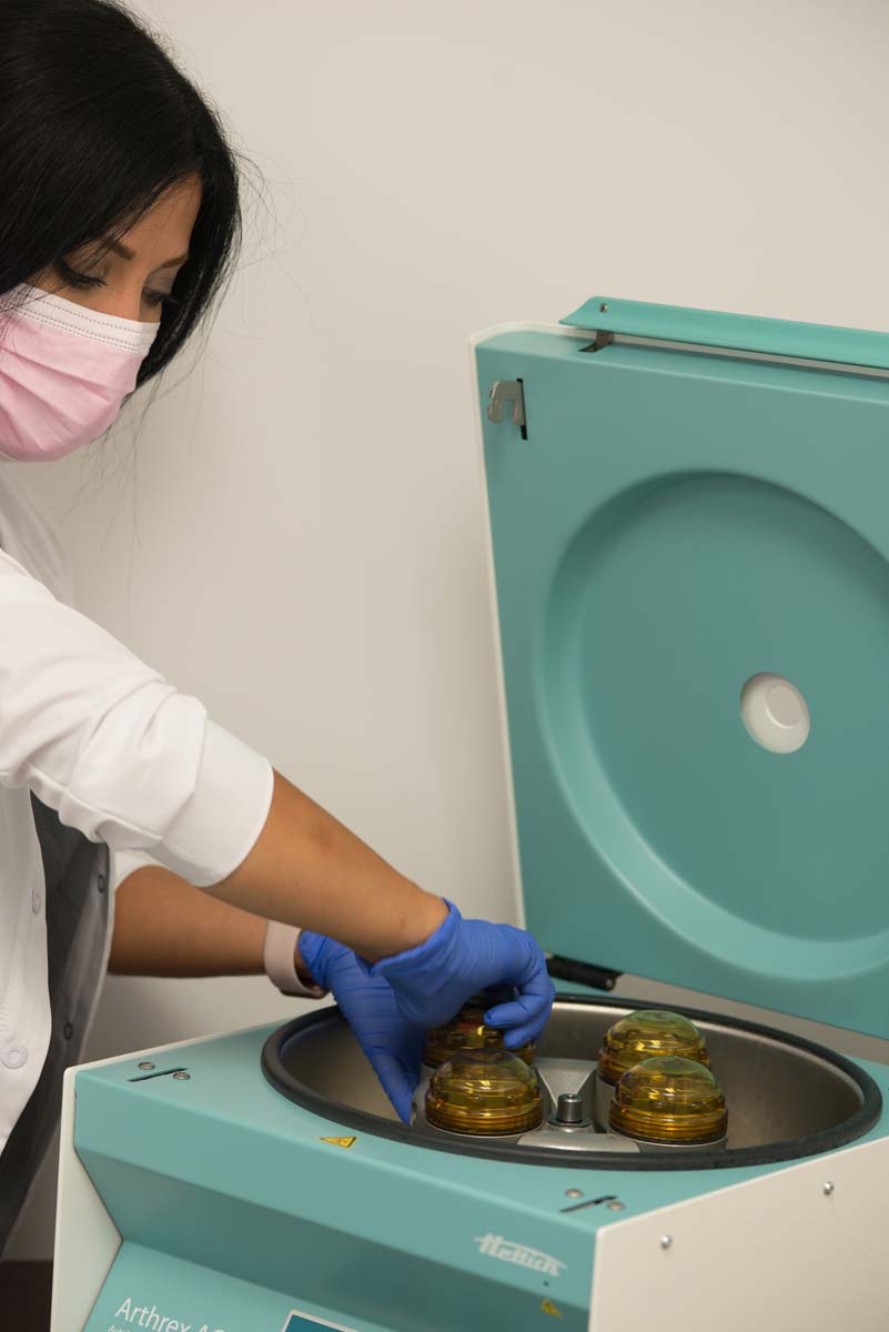 Female technician preparing blood for prp platelet rich plasma vampire facelift