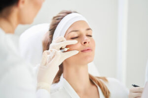 Woman getting a face injection